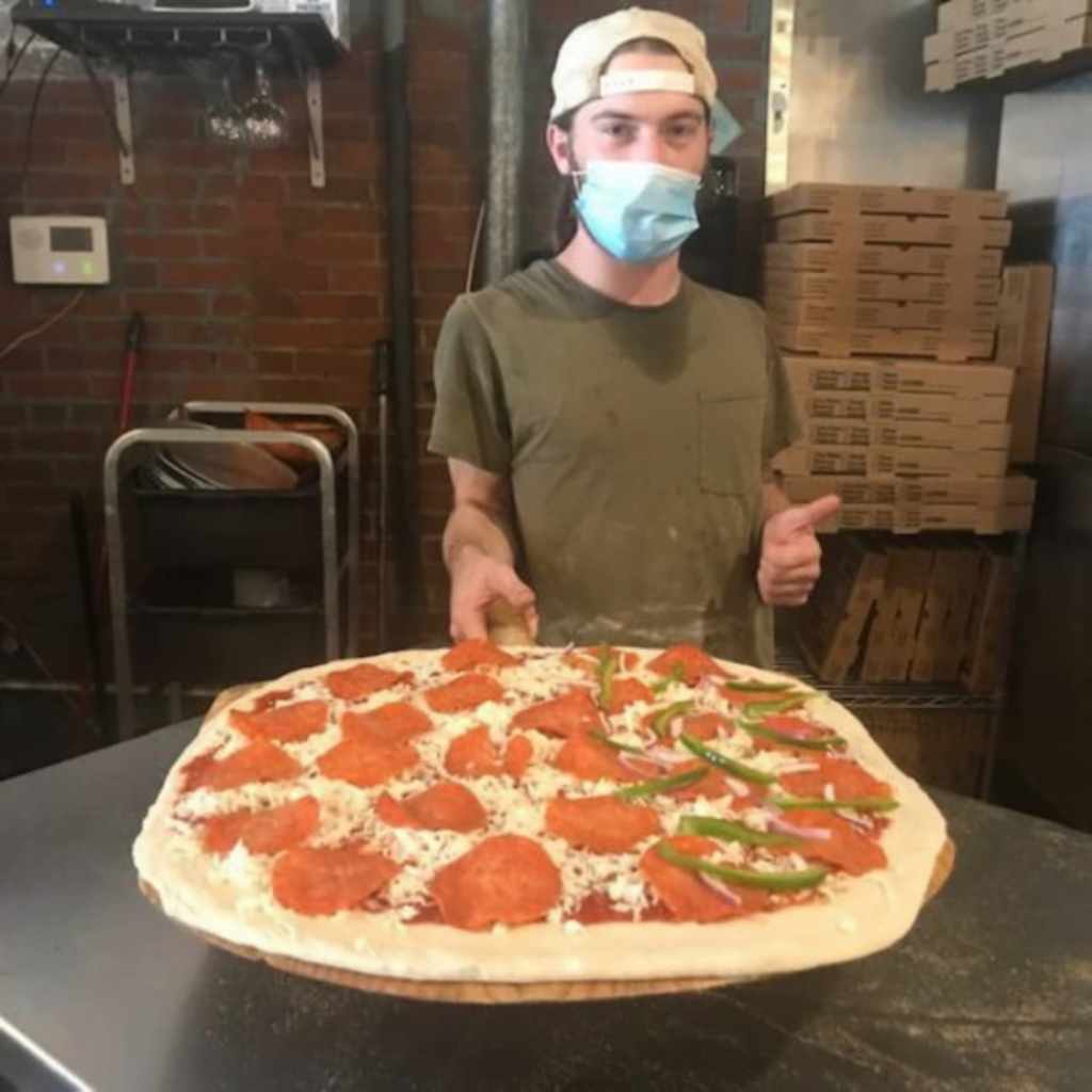 Pizza ready for the oven at Decent Pizza in Tallahassee, FL