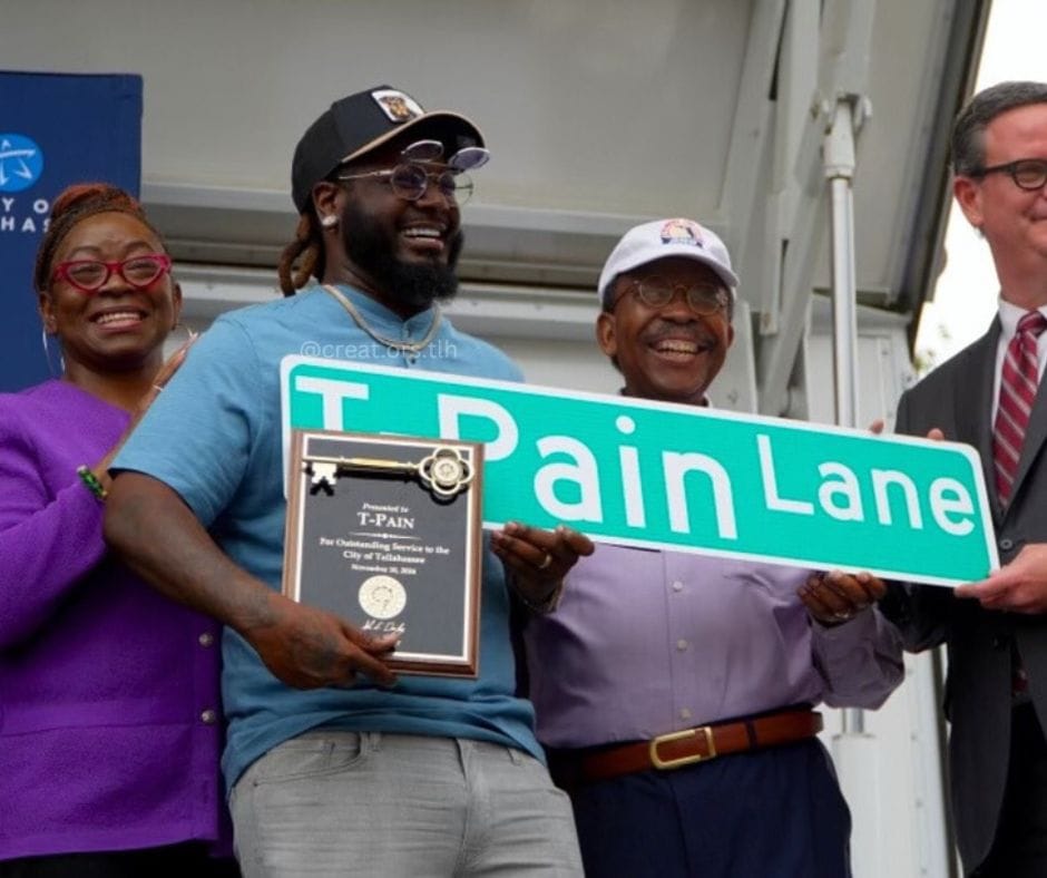 Photo taken of T-Pain and his street name sign