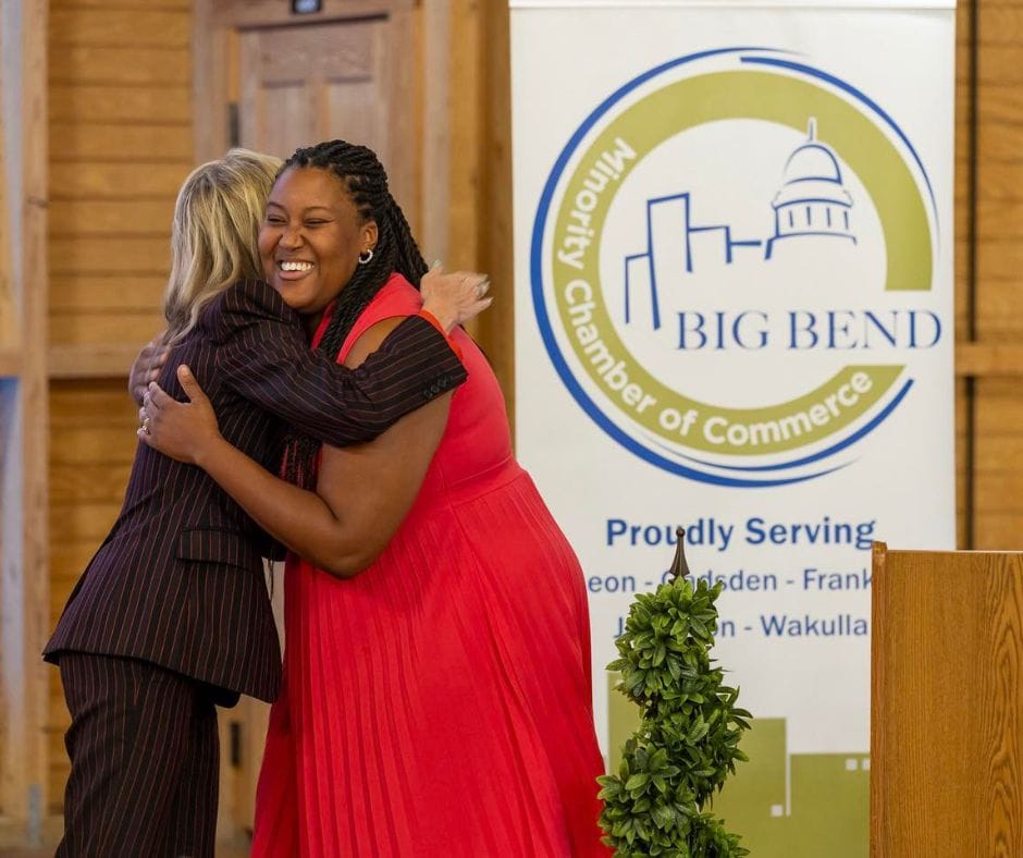 Two women hugging each other at a Big Bend event