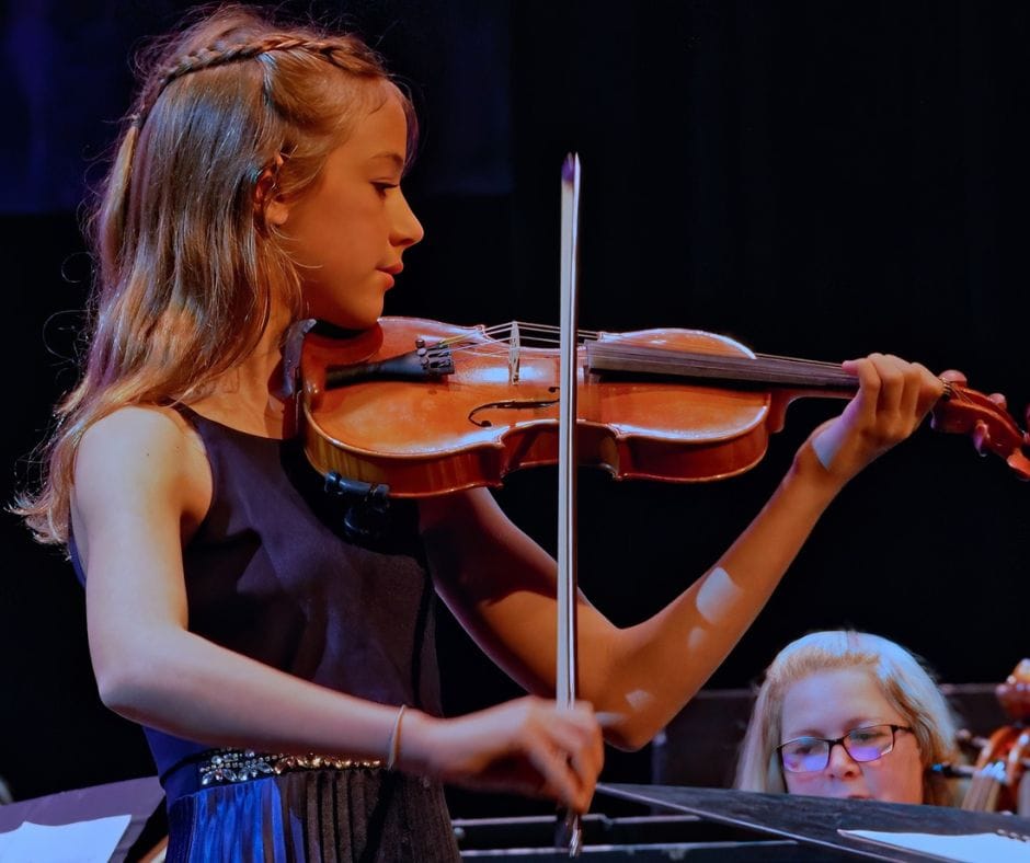 A young lady playing the violin