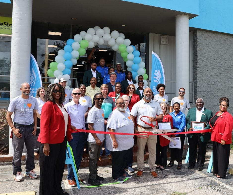 Group of people at a ribbon cutting event