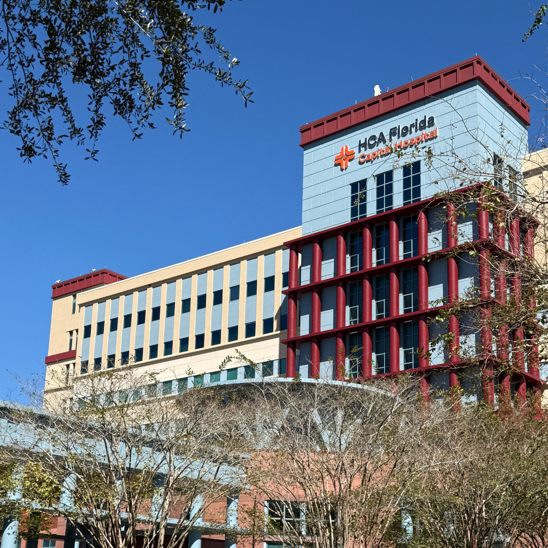 Exterior of HCA Florida Hospital on a sunny day, with trees in the foreground