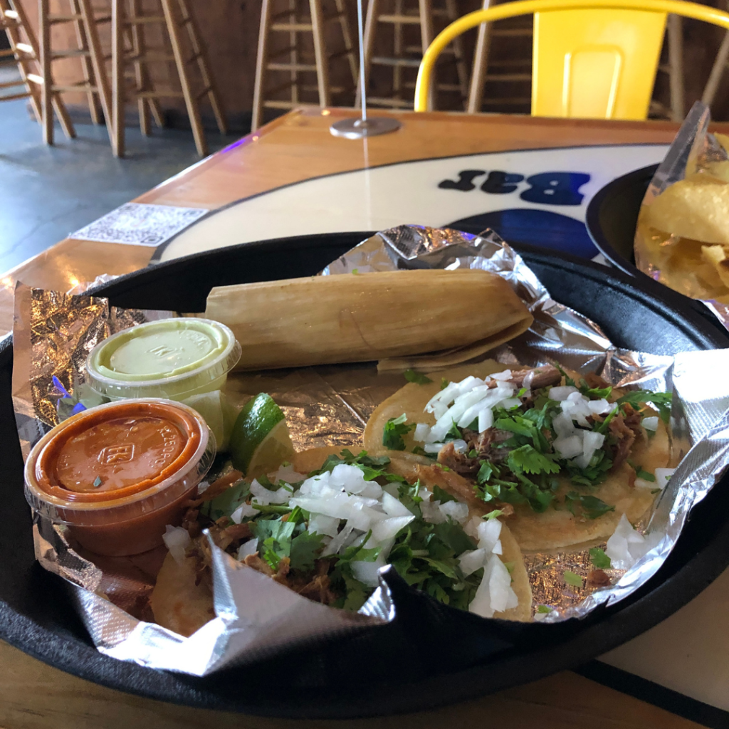 Carnitas street tacos and a pork tamale