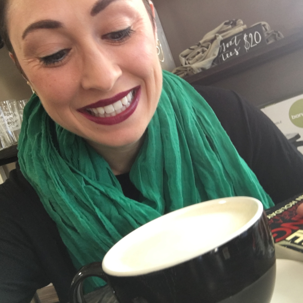 Woman enjoying a latte at Lucky Goat in Tallahassee